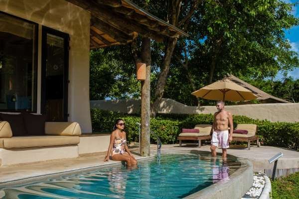 couple-men-and-women-on-a-luxury-vacation-at-a-pool-villa.jpg